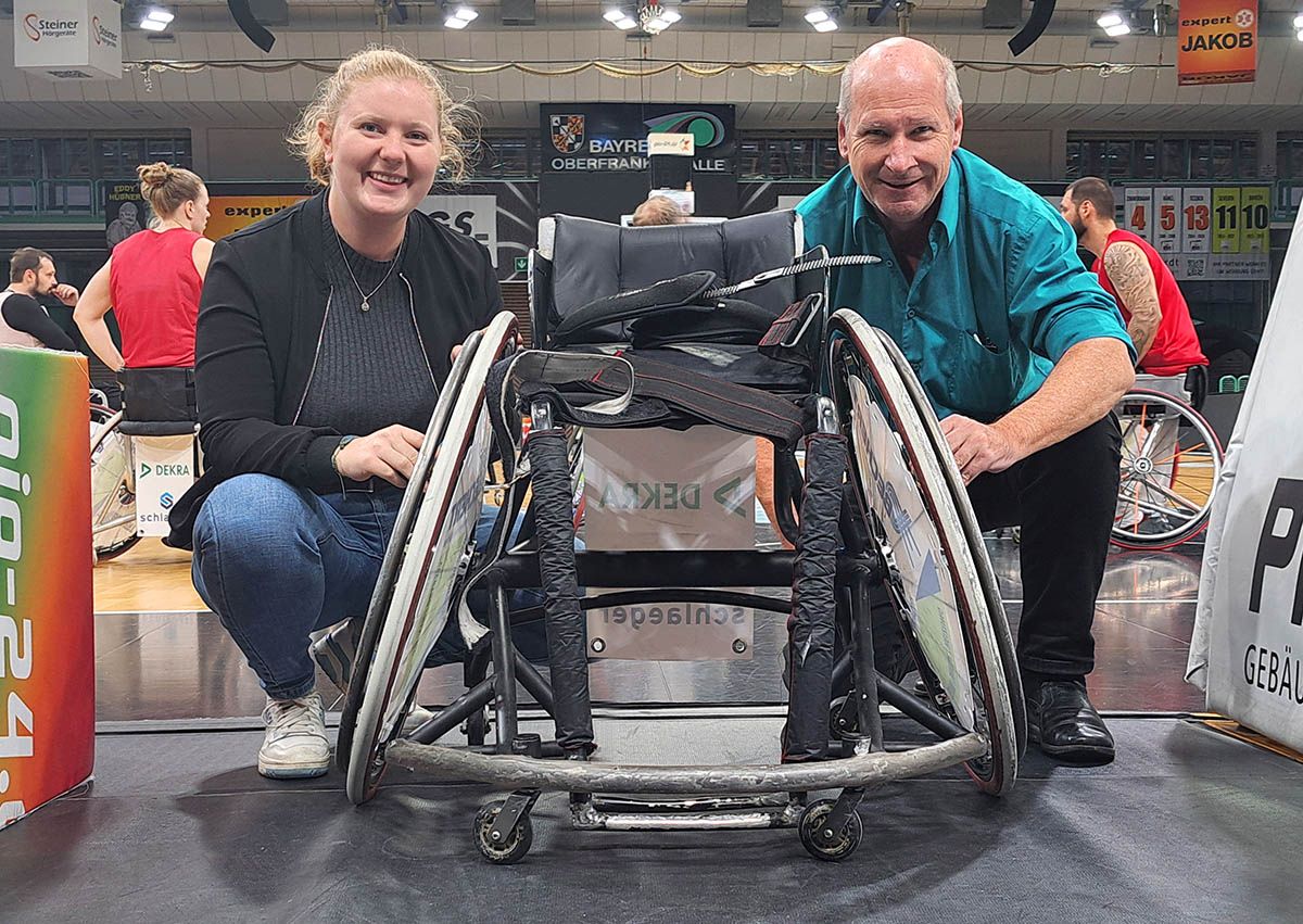 Prof. Fuss mounting sensors on wheelchair